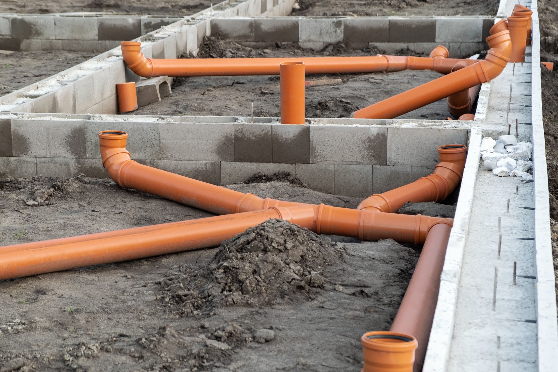 New Installed pipework system. Sewer Line developed and mounted on the construction site.