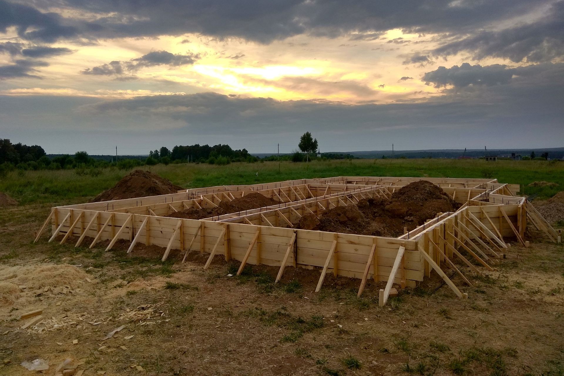 Wooden formwork concrete strip foundation for a cottage